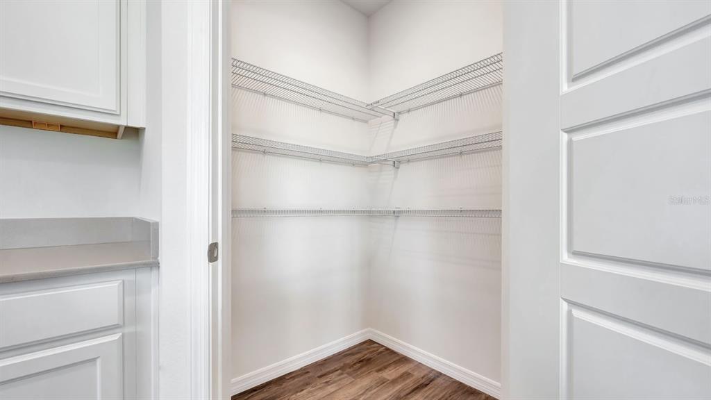 3598 Roden Road Haines City, FL 33844 - Photo 11 of 26 a view of walk in closet with empty racks