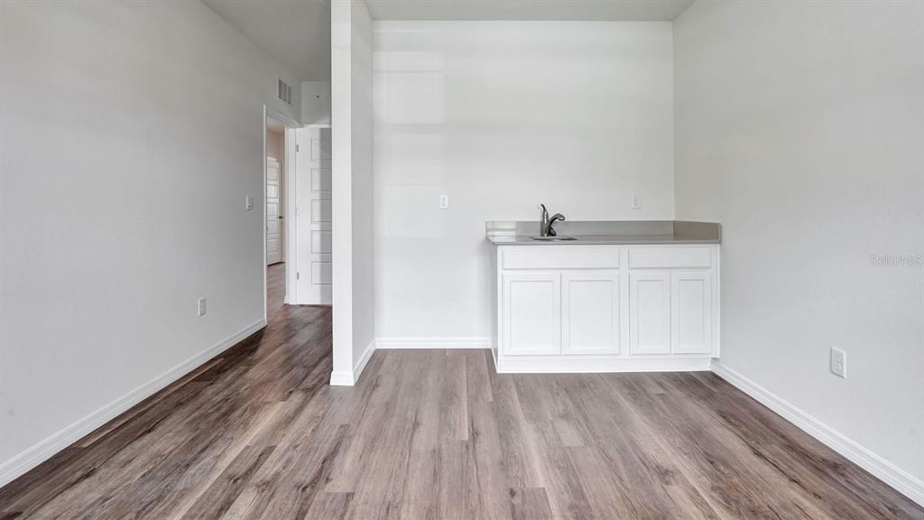 3598 Roden Road Haines City, FL 33844 - Photo 14 of 26 a view of a room with wooden floor