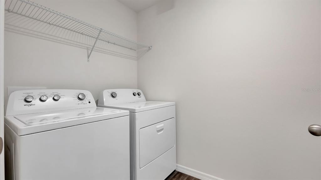 3598 Roden Road Haines City, FL 33844 - Photo 24 of 26 a utility room with dryer and washer