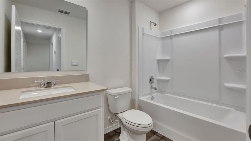 3598 Roden Road Haines City, FL 33844 - Photo 25 of 26 a bathroom with a sink toilet and shower