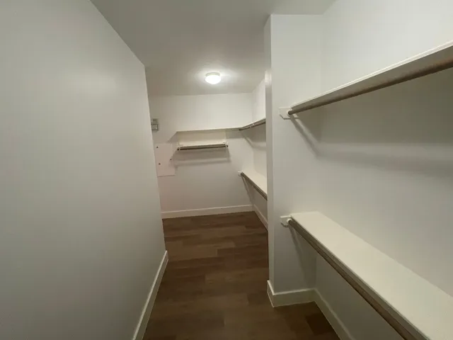 a view of storage and utility room with empty racks