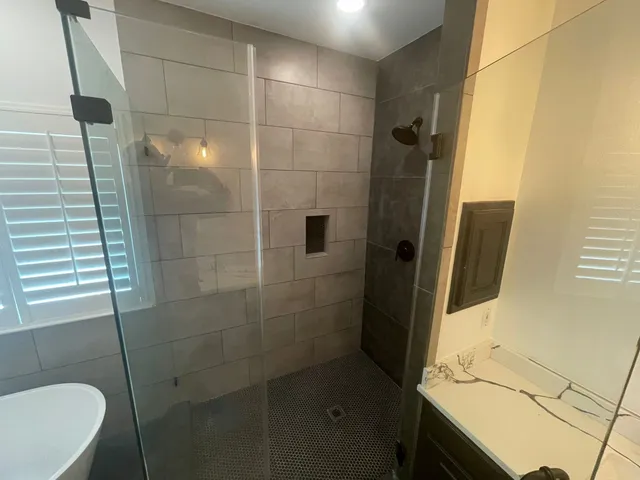 a bathroom with a sink and mirror