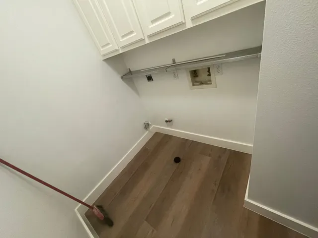 a bathroom with a sink and washing machine