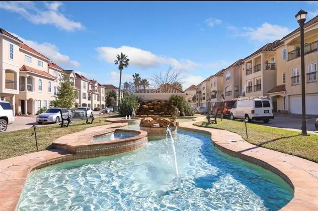 a view of a swimming pool with a lounge chairs