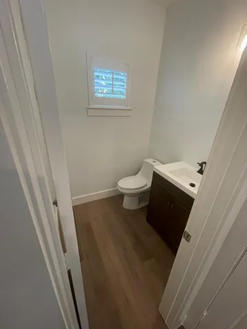 a view of kitchen with sink and wooden floor
