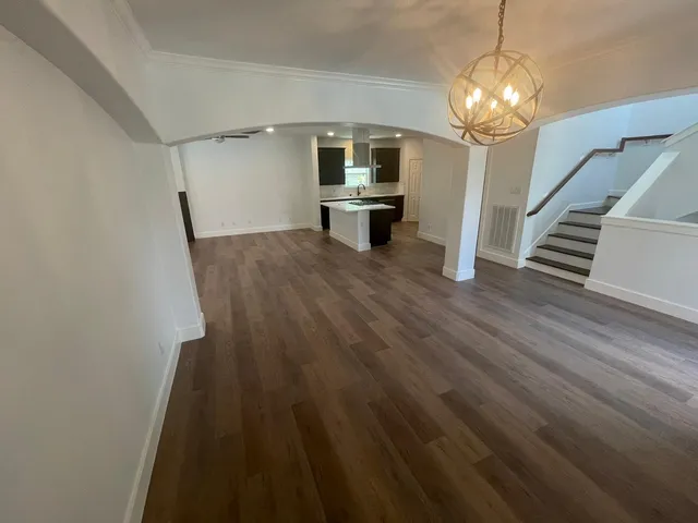 a kitchen with granite countertop a stove and a sink