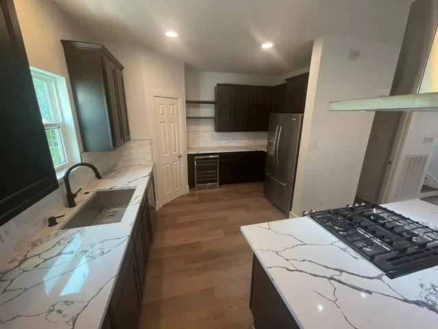 a view of an empty room with a fireplace