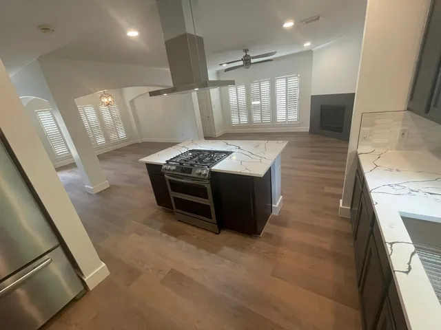 view of house with potted plants