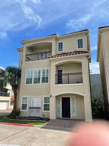 a large bathroom with a large tub sink vanity granite and mirror