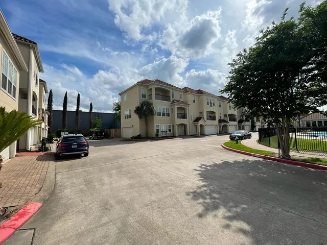 a view of a street with cars