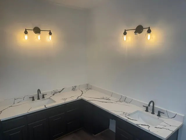 a bathroom with a sink and mirror