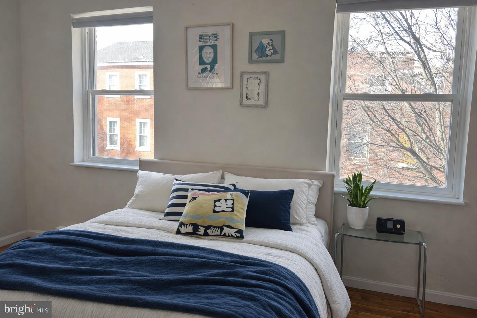 407 South 10th Street, Unit 2 Philadelphia, PA 19147 - Photo 4 of 5 a bed sitting in a bedroom next to a window