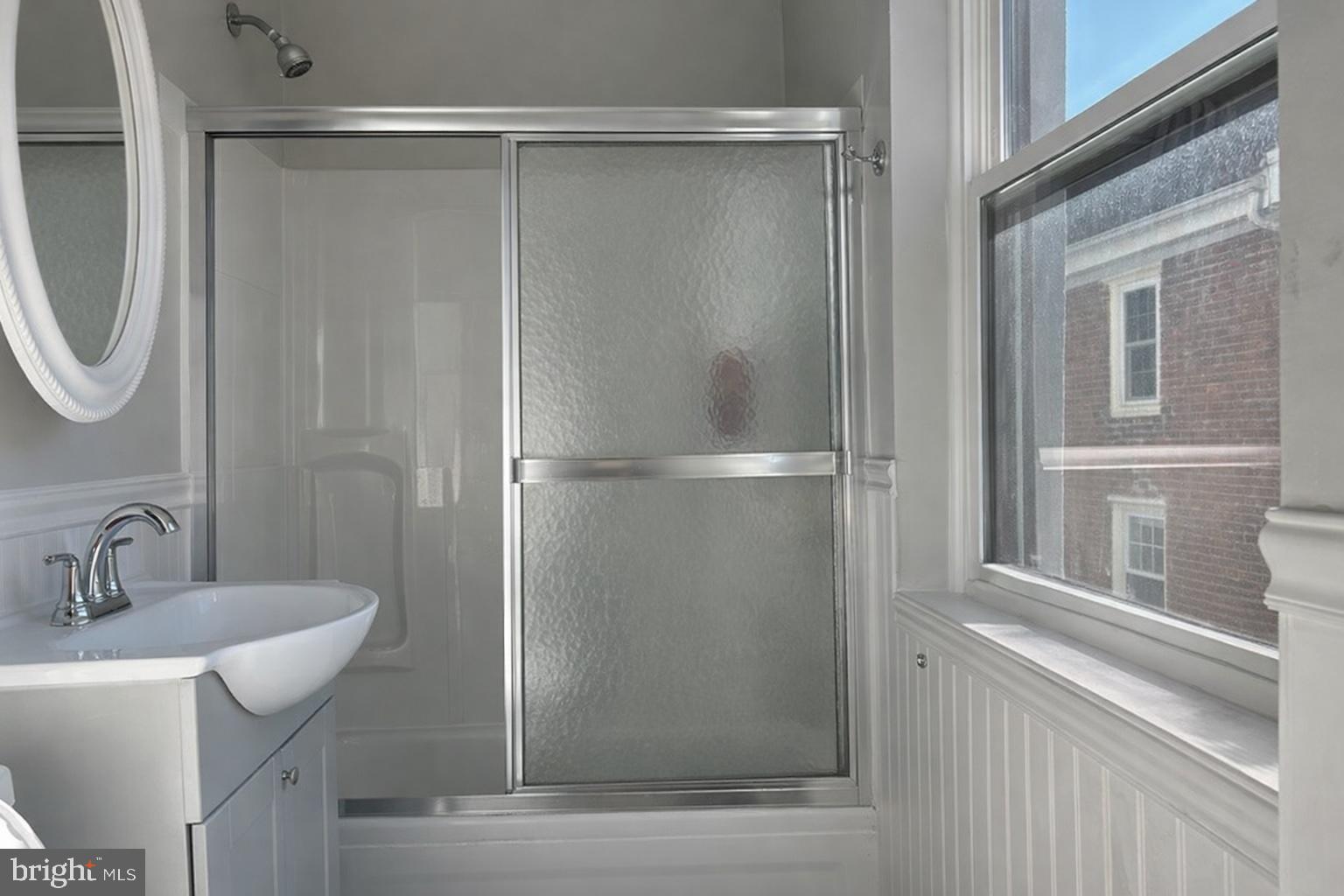 407 South 10th Street, Unit 2 Philadelphia, PA 19147 - Photo 5 of 5 a bathroom with a shower and a sink