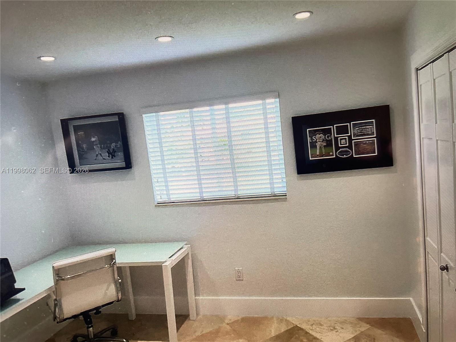 10900 Southwest 107th Avenue Miami, FL 33176 - Photo 16 of 26 a view of a workspace with furniture and a window