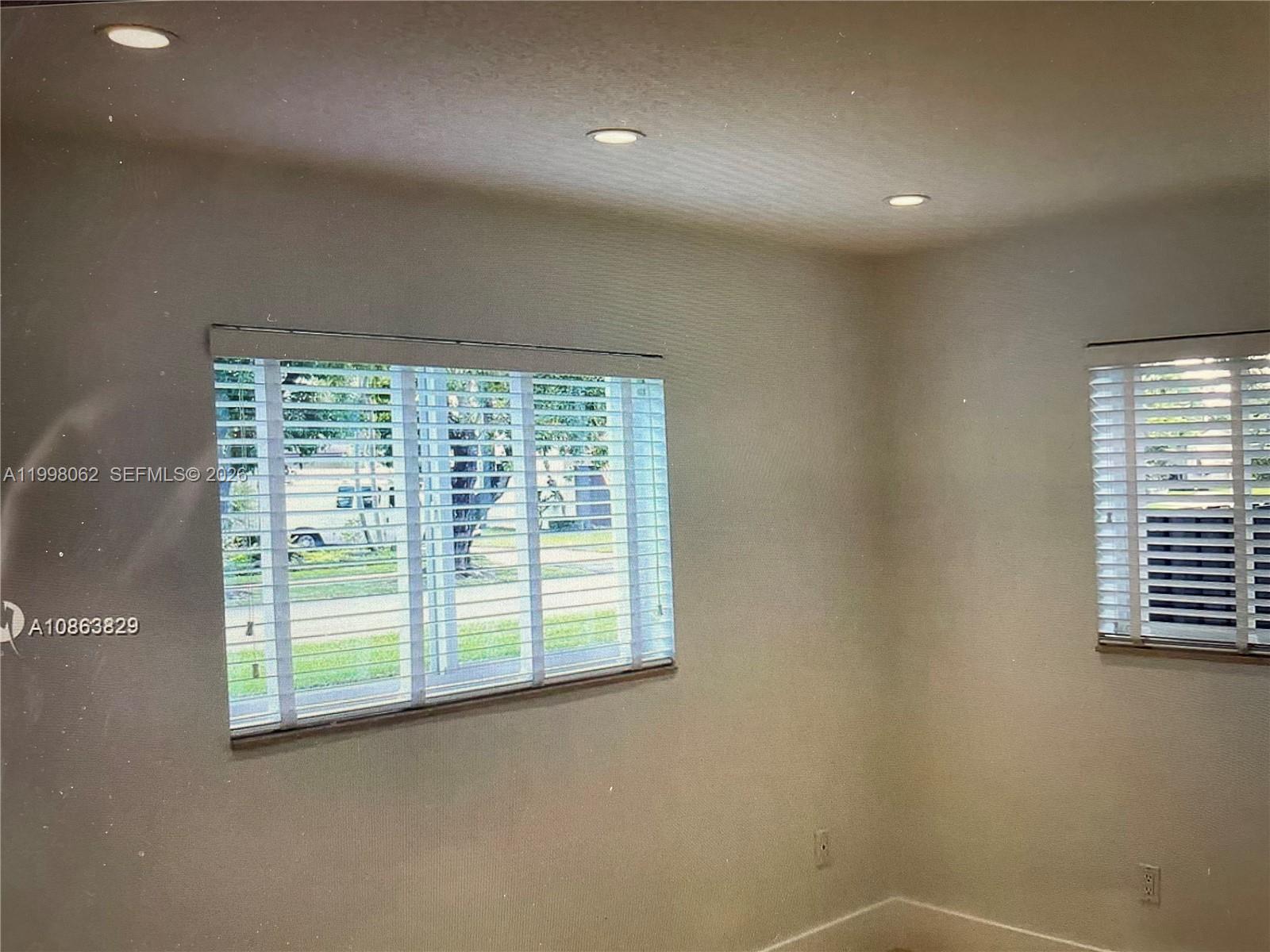 10900 Southwest 107th Avenue Miami, FL 33176 - Photo 17 of 26 a view of a room that has a window in it
