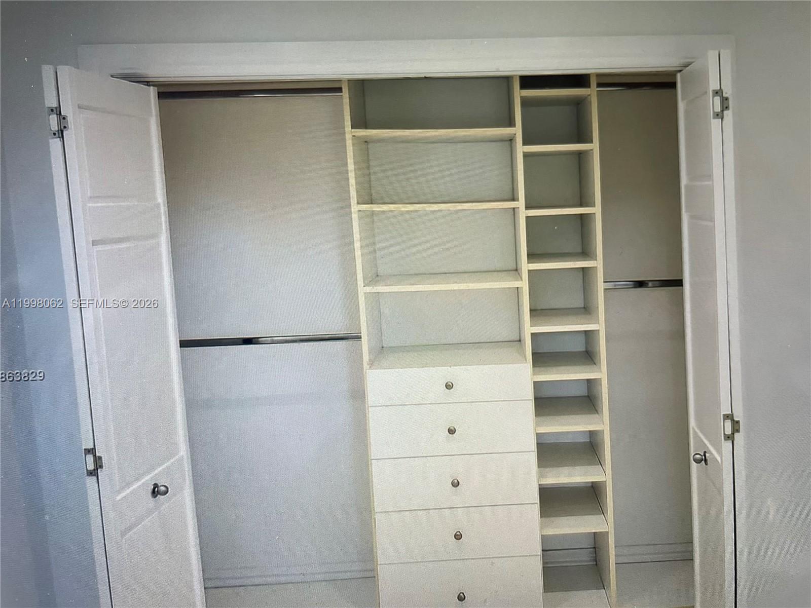 10900 Southwest 107th Avenue Miami, FL 33176 - Photo 18 of 26 a view of walk in closet with empty racks