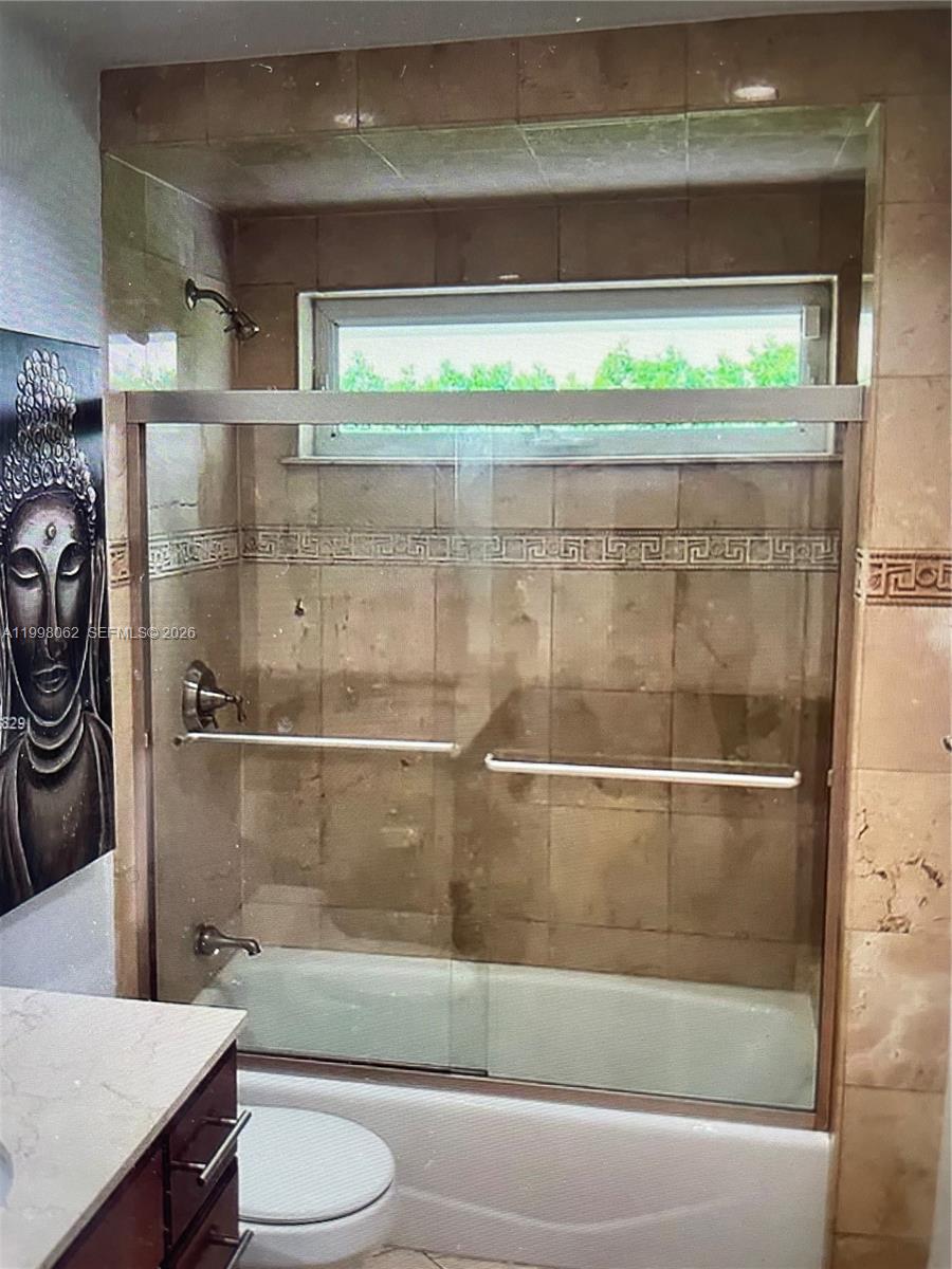 10900 Southwest 107th Avenue Miami, FL 33176 - Photo 20 of 26 a bathroom with a shower a toilet and a sink