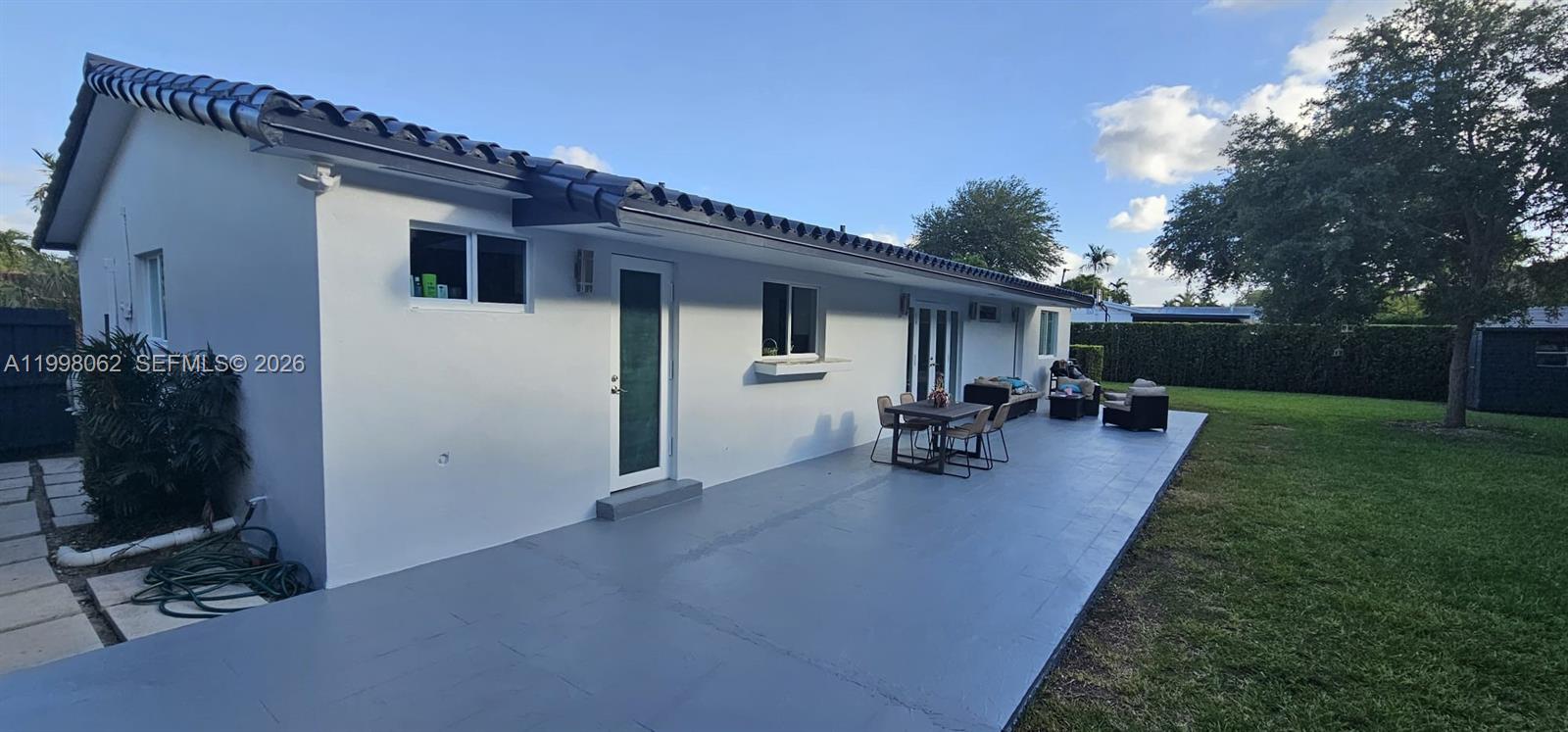 10900 Southwest 107th Avenue Miami, FL 33176 - Photo 21 of 26 a view of a backyard with sitting area