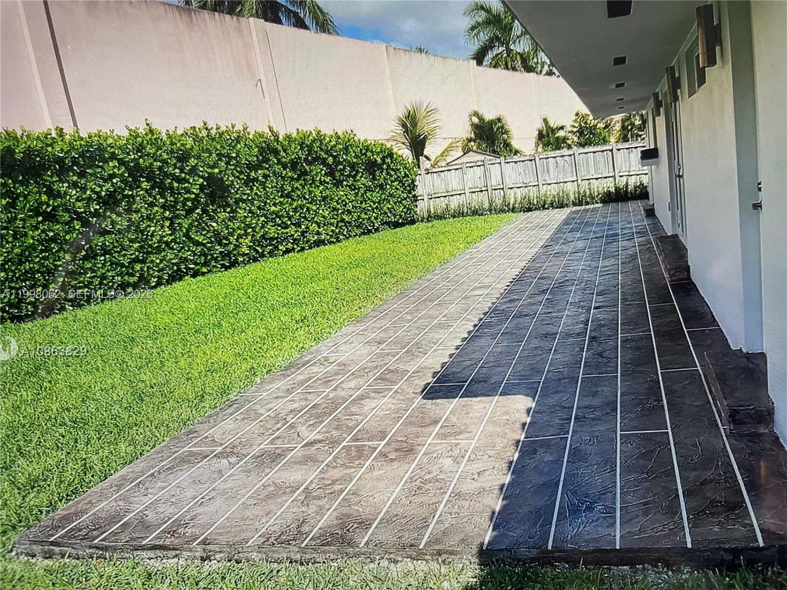10900 Southwest 107th Avenue Miami, FL 33176 - Photo 25 of 26 a view of a pathway both side of garden