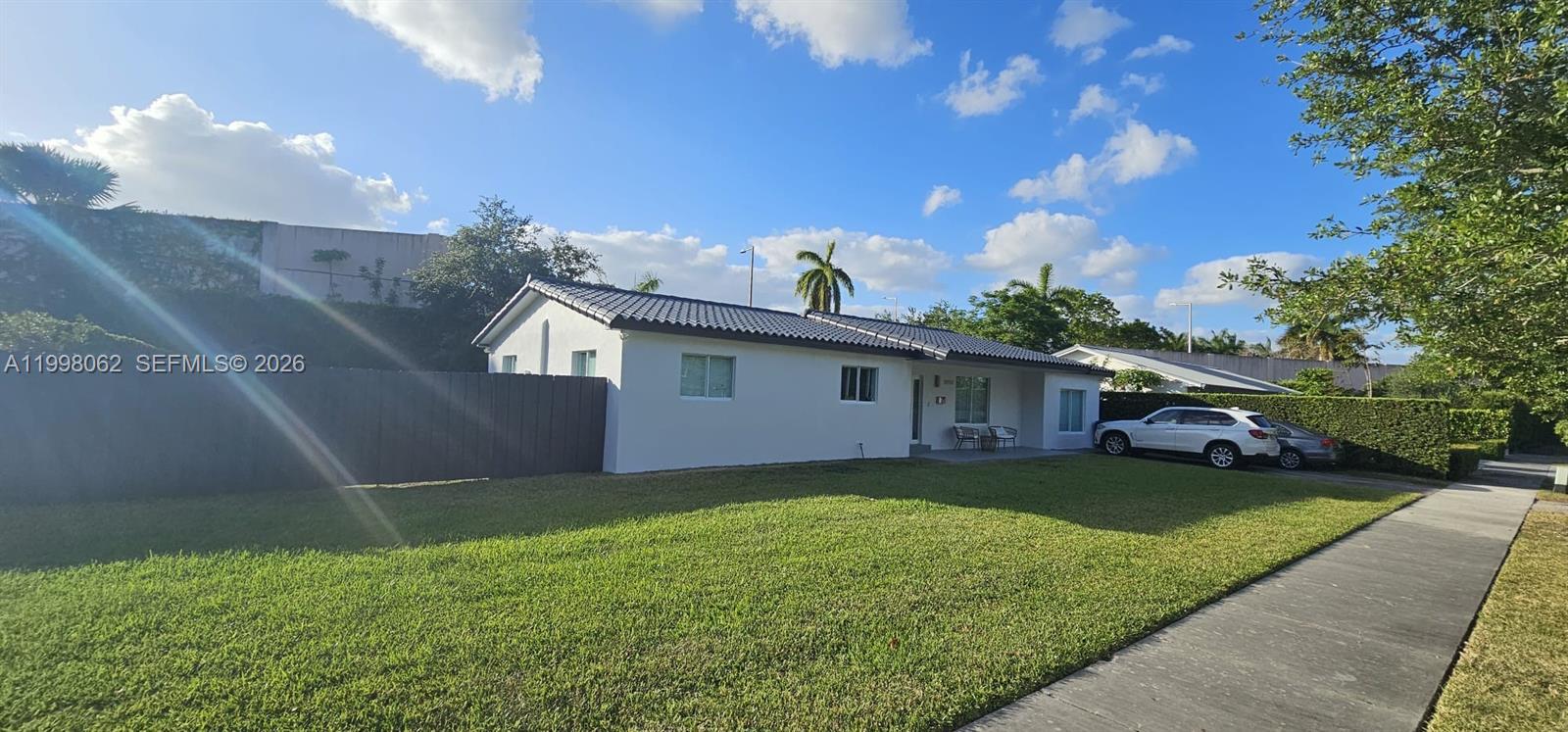 10900 Southwest 107th Avenue Miami, FL 33176 - Photo 3 of 26 a view of a yard in front of house