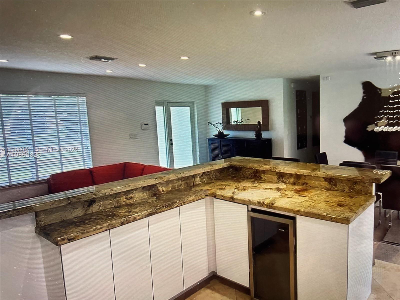 10900 Southwest 107th Avenue Miami, FL 33176 - Photo 7 of 26 a bathroom with a granite countertop sink and a mirror