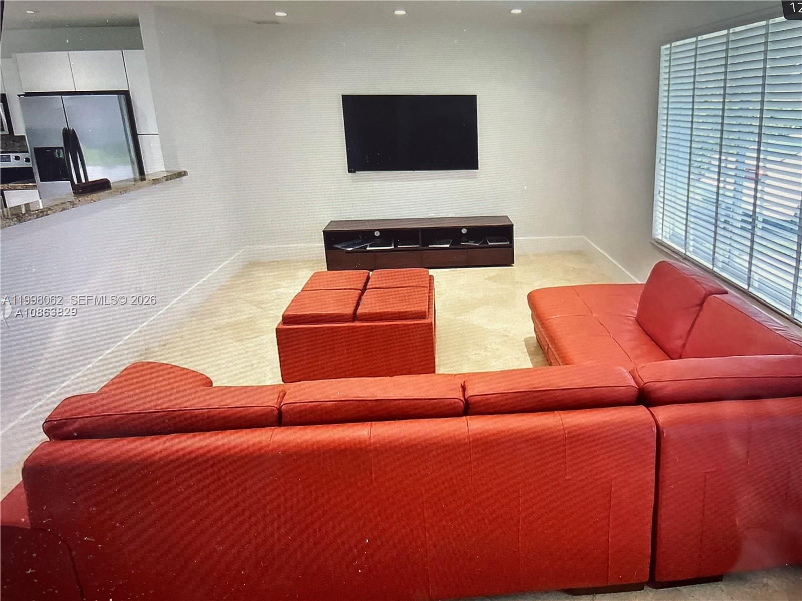 10900 Southwest 107th Avenue Miami, FL 33176 - Photo 10 of 26 a living room with furniture and a flat screen tv