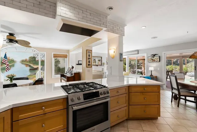 a kitchen with a stove and cabinets