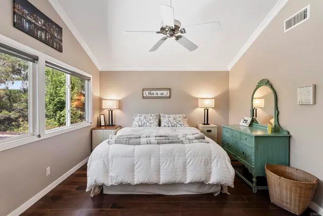 a bed room with a bed and a chair