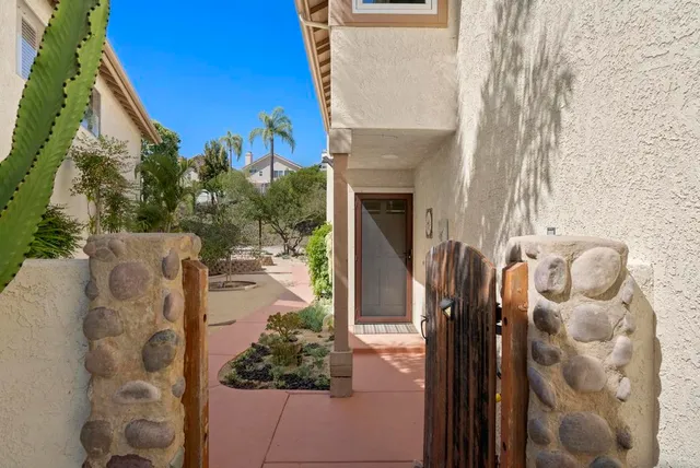 a view of small pond with patio