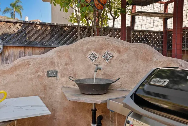 a view of a backyard with table and chairs