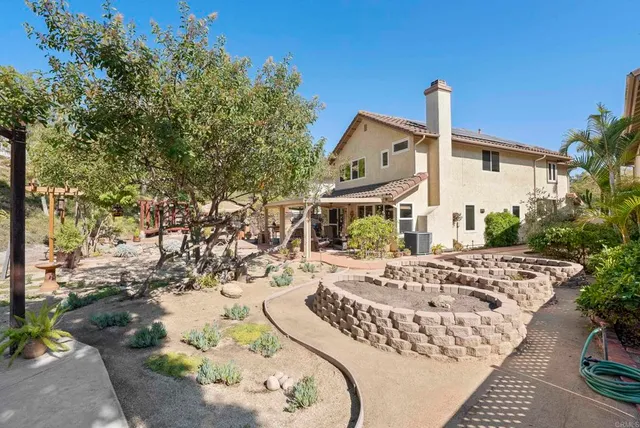 a view of a dinning table and chairs in the patio