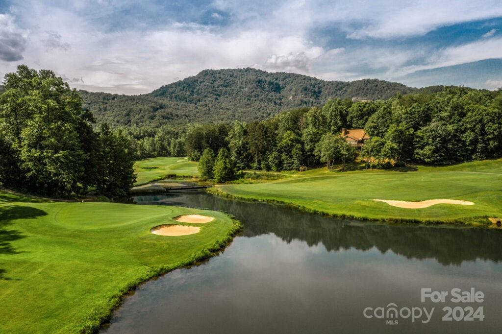 635 Slick Rock Road Hendersonville, NC 28792 - Photo 15 of 24 a view of a golf course with a lake view