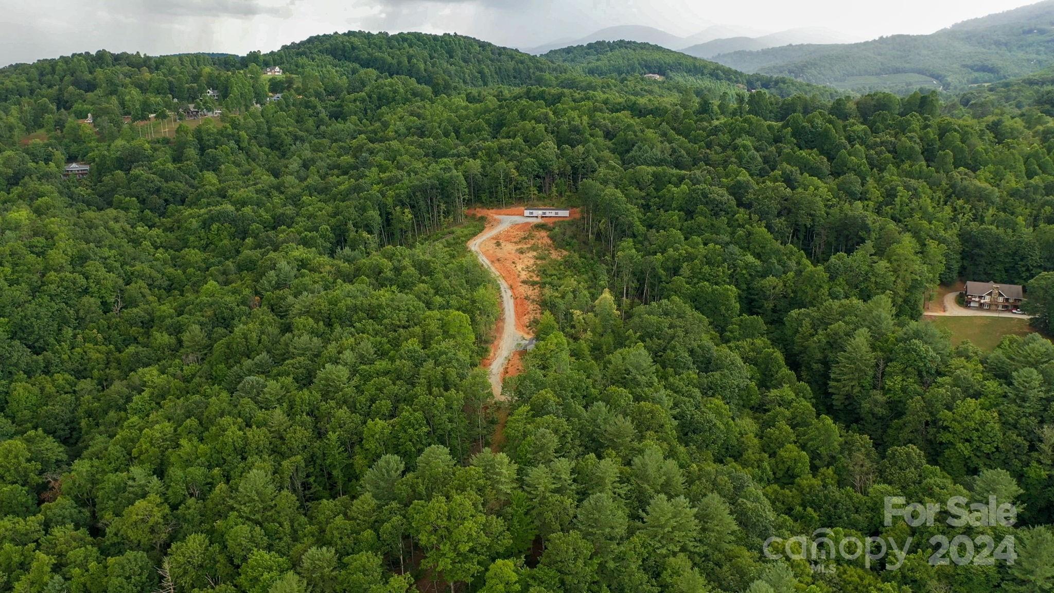 635 Slick Rock Road Hendersonville, NC 28792 - Photo 8 of 24 a map view of a house with a lush green forest