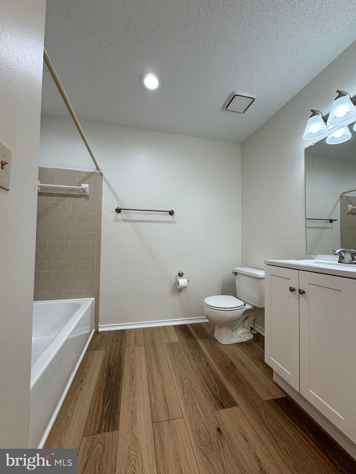 20952 Timber Ridge Terrace, Unit 301 Ashburn, VA 20147 - Photo 13 of 14 a bathroom with a sink and a toilet