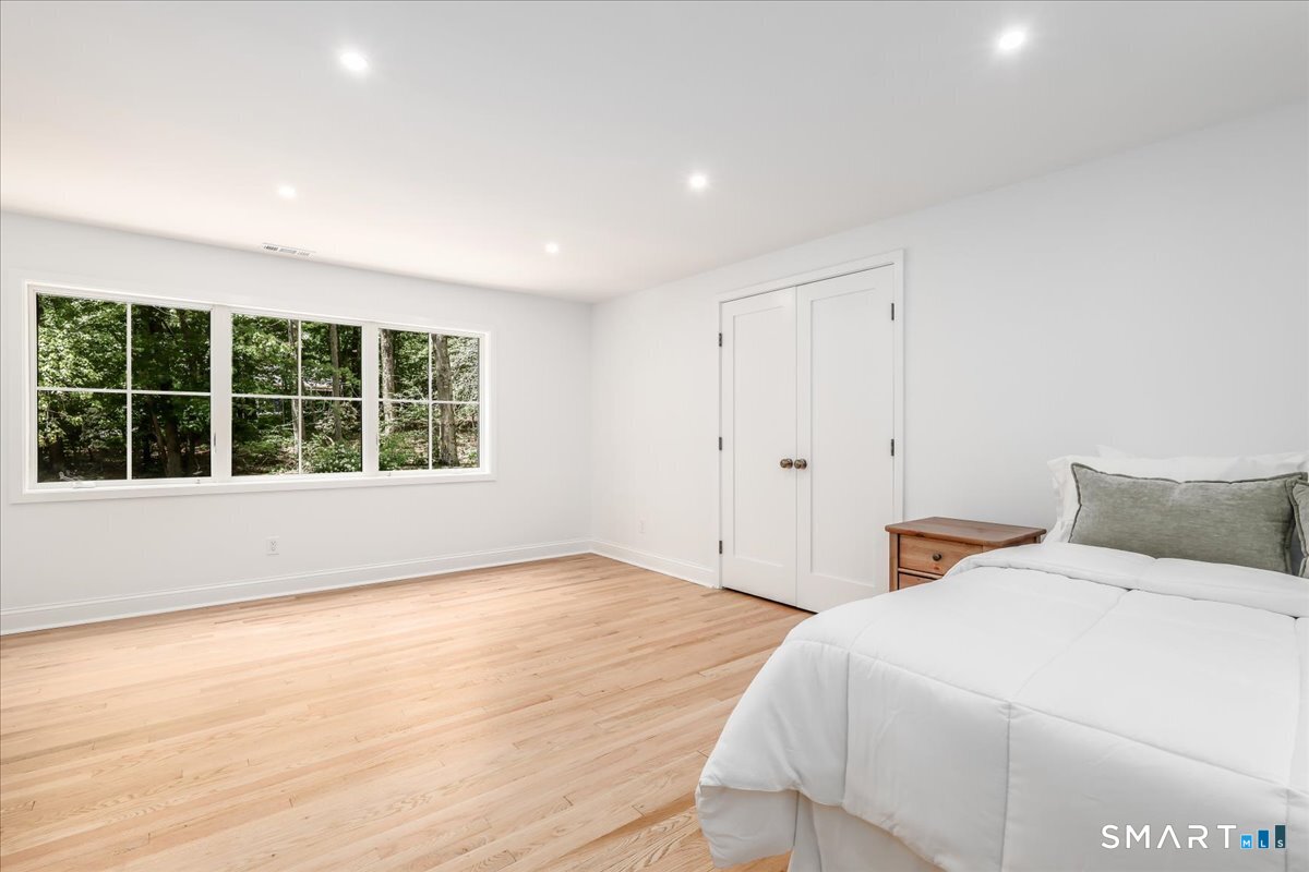 256 Wilton Road East Ridgefield, CT 06877 - Photo 25 of 40 a bedroom with a bed and a window