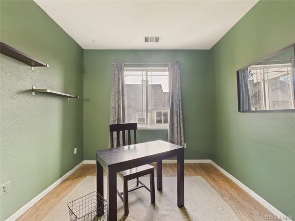 a workspace with furniture and window