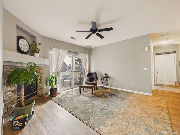 a kitchen with furniture a stove and a refrigerator