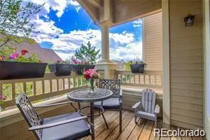 a view of a two chairs and table in the balcony