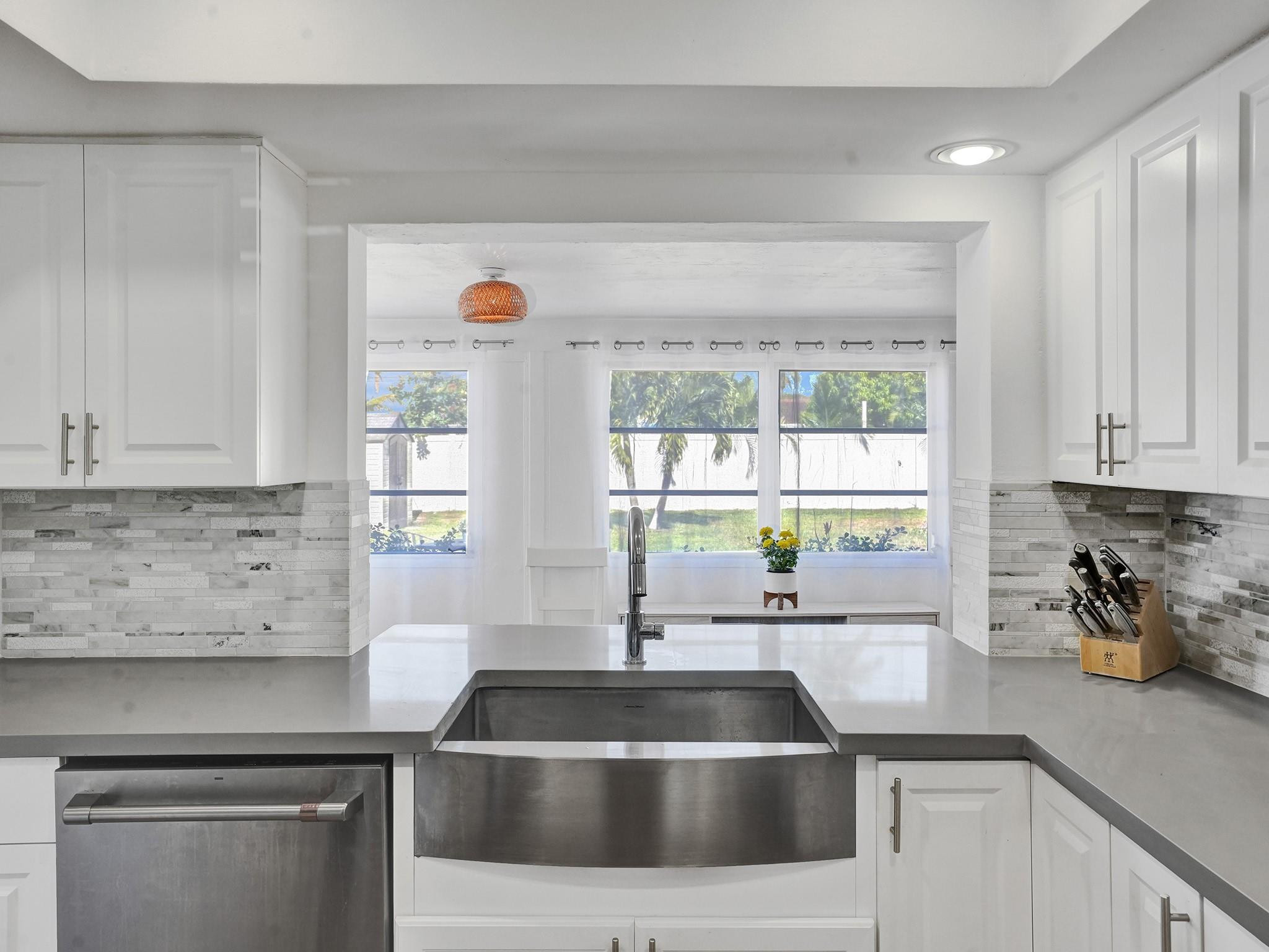 1119 Southwest 14th Street Boca Raton, FL 33486 - Photo 32 of 43 a kitchen with a sink and a window