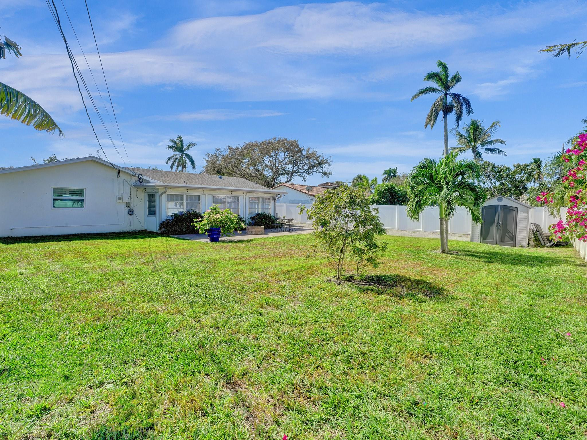 1119 Southwest 14th Street Boca Raton, FL 33486 - Photo 40 of 43 a view of a house with a big yard