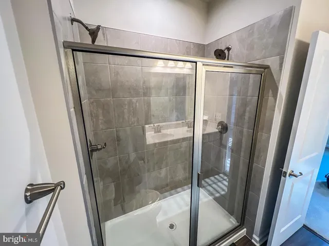 a bathroom with a shower and a tub