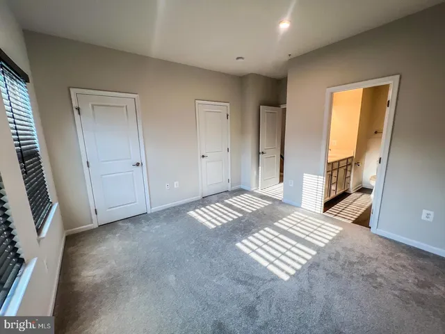 a view of an empty room and a window