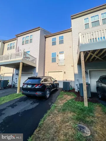 a view of a car park in front of house