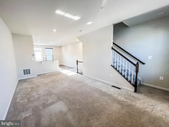 a view of a hallway with staircase
