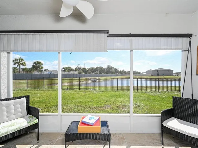 a bedroom with a bed and a night stand
