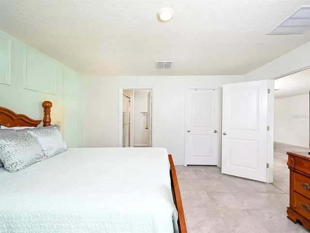 a bathroom with double vanity sinks and a mirror