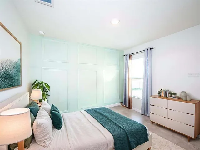 an empty room with closet and entryway