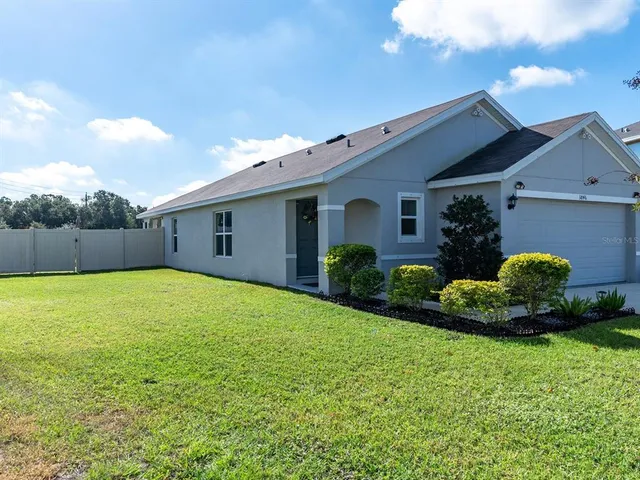 an aerial view of houses with outdoor space