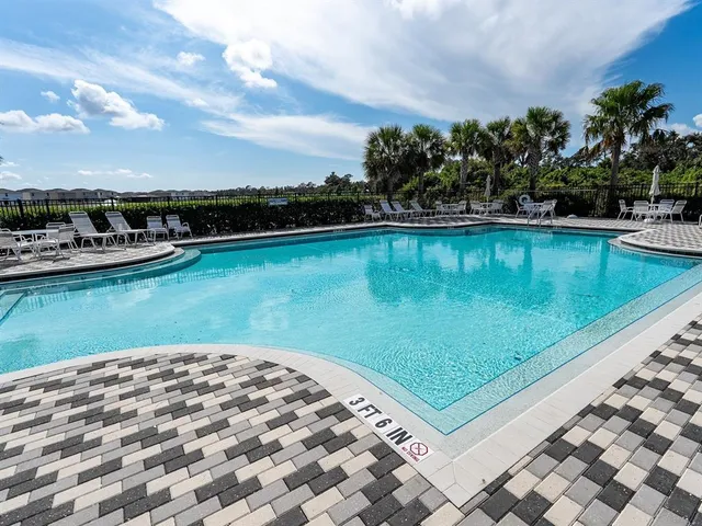 a view of a swimming pool with a patio