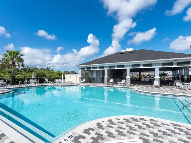 a view of a cars park in front of retail shop